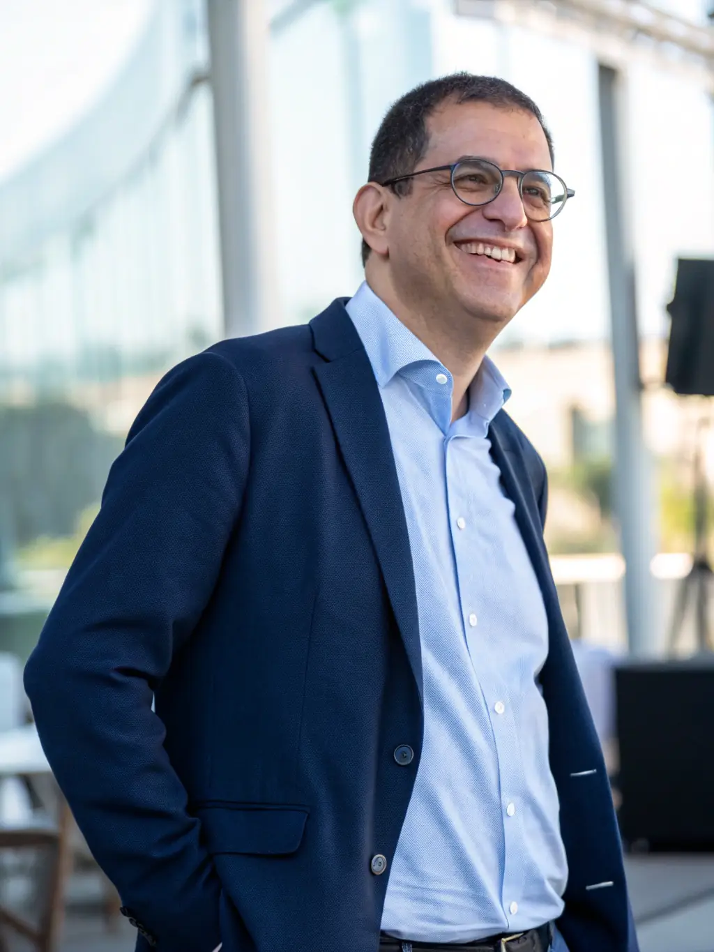 A confident man in his 40s, looking directly at the camera with a strong, healthy posture, representing the benefits of testosterone therapy at Rebel Healthcare.